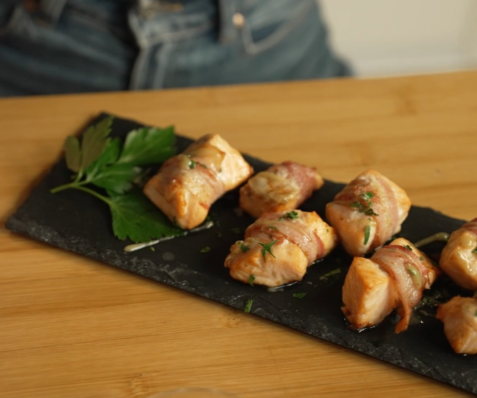 Salmon bites with crispy bacon in air fryer