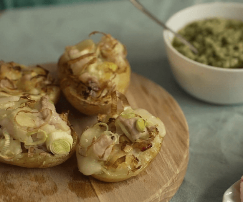 Stuffed potatoes leeks bacon and provolone cheese with salsa verde