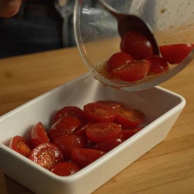 put cherry tomatoes in a baking paper